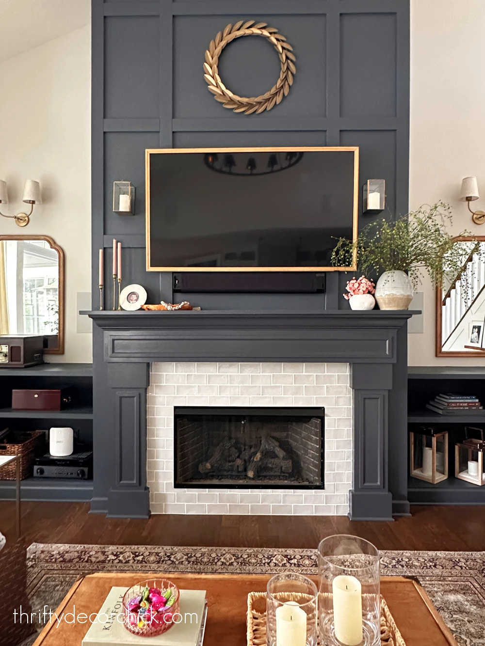 tall fireplace with wood trim